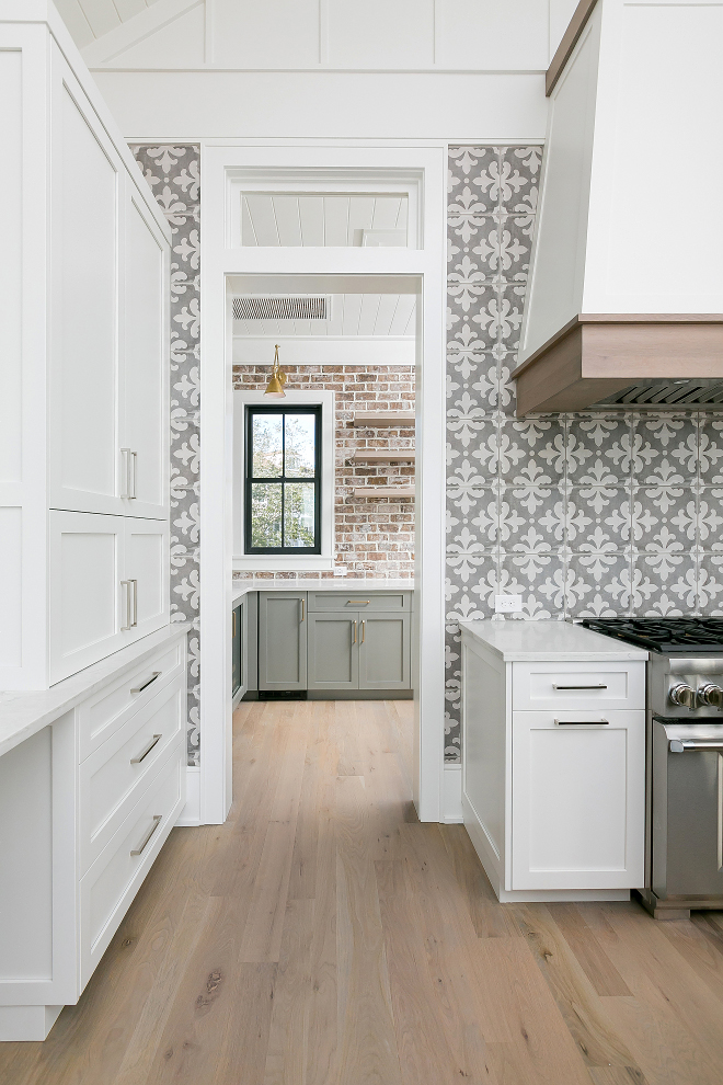 Sherwin Williams Pure White Kitchen with White Oak Hardwood Floor and Grey Cement Tile