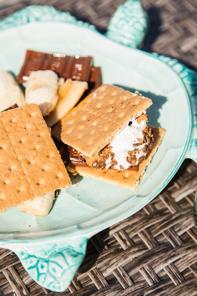 Smores fire-roasted marshmallow and a layer of chocolate sandwiched between two pieces of graham cracker