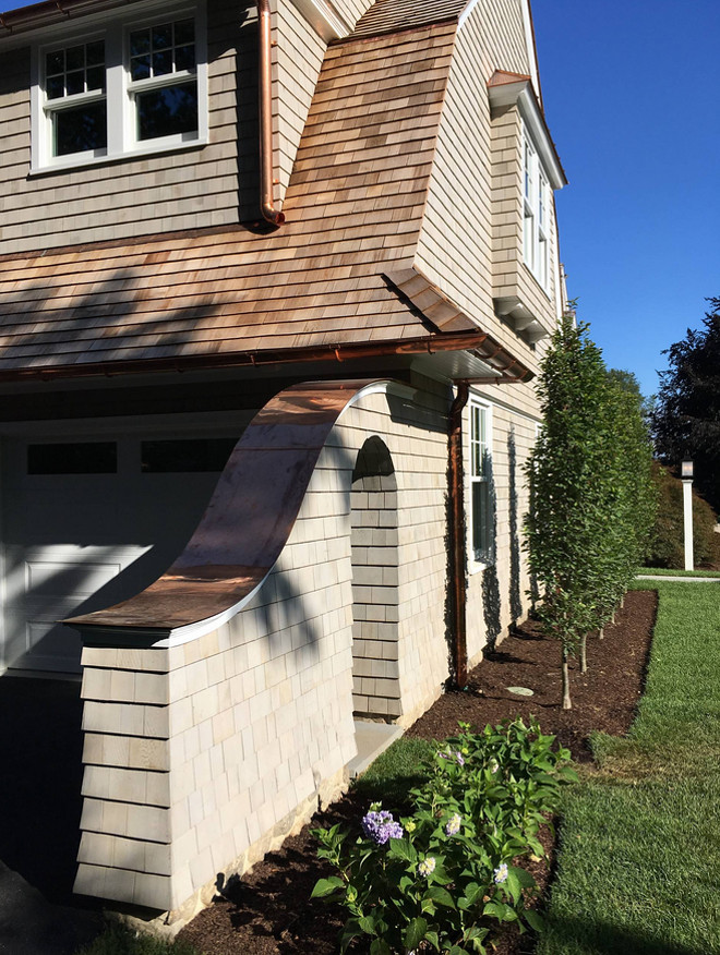 Gambrel Shingle home with copper gutter