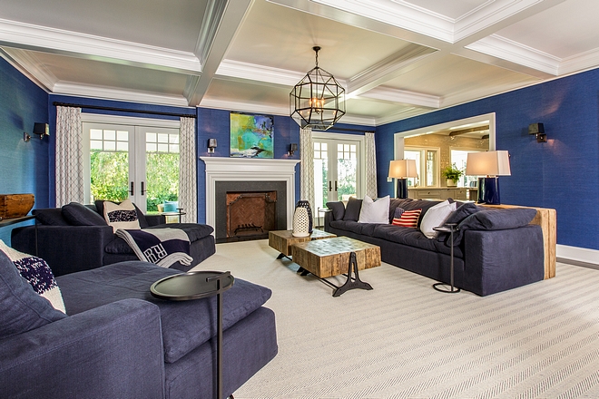 Family room features French doors flanking a fireplace