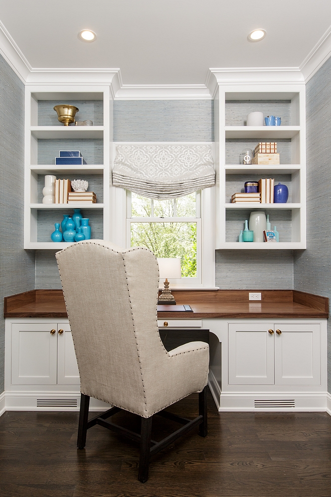 Home Office This practical home office features custom cabinetry with Walnut top and light grey wallpaper