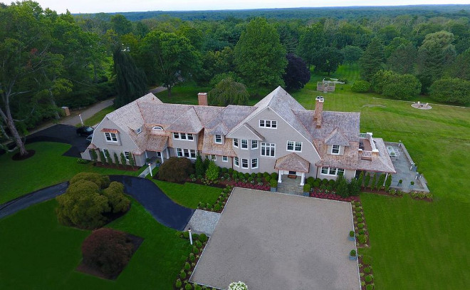 Residencial drone photography Perfectly sited, with majestic views, this shingle-style home is naturally elegant and grand-in-style
