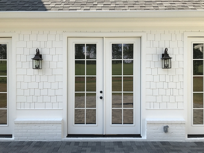 Outdoor Sconce Lighting, white single siding and painted white brick source on Home Bunch 