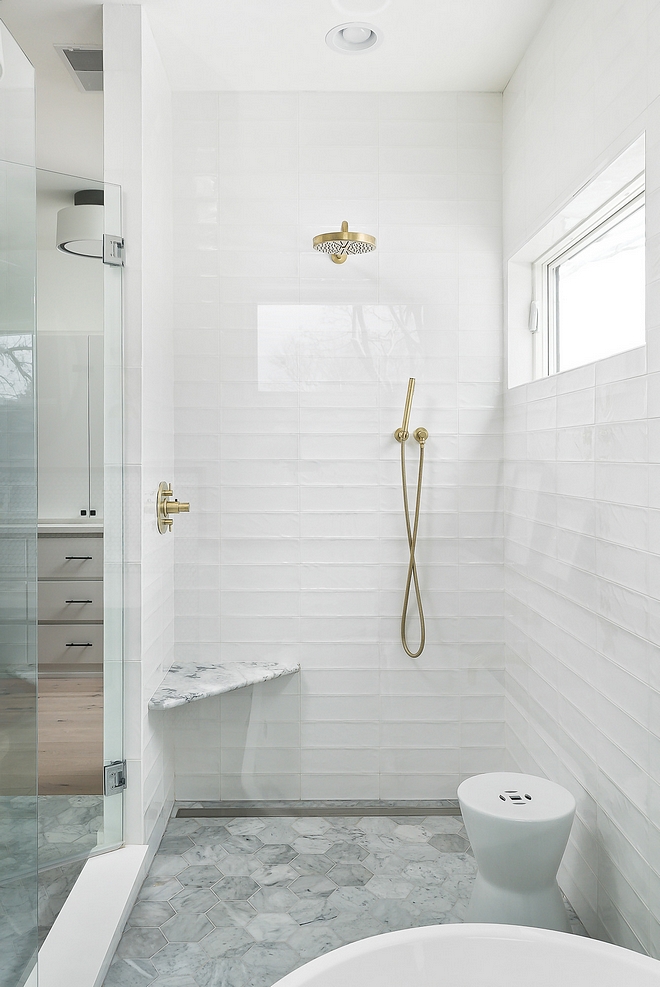 Bathroom tile Bathroom tiles are carrara 6" hex tiles on floor with a linear drain Subway long subway tiles have been stacked for a modern look These are glossy white with a wavy texture