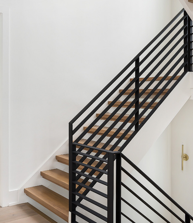 Metal Railing Staircase Metal Railing The staircase features White Oak treads and a custom black steel railing