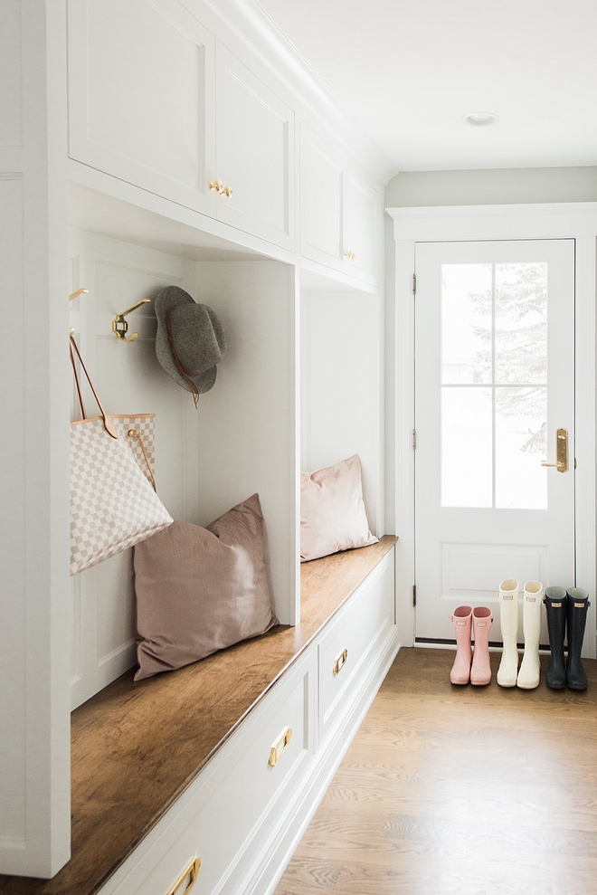 White mudroom lockers with wood stained bench and hardwood floors White mudroom lockers with wood stained bench and hardwood floor #Whitemudroom #mudroomlockers #mudroom #lockers #whitelockers #mudroombench