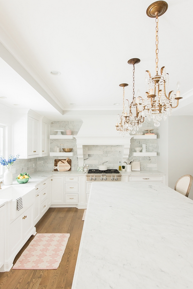 Kitchen remodel I fell in love with blogger Rachel Parcell’s kitchen - the oversized range hood and open shelving with a marble backsplash that ran to the ceiling. I loved every detail so I worked with my builder to incorporate as many elements of that inspiration as possible into our space #kitchenremodel