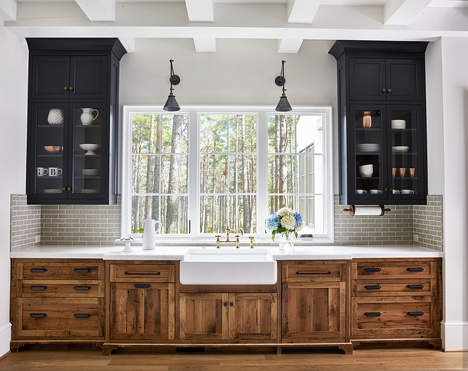 Kitchen Wood cabinetry is reclaimed white oak with a clear, matte sealant Upper cabinets are painted in Midnight Oil by Benjamin Moore