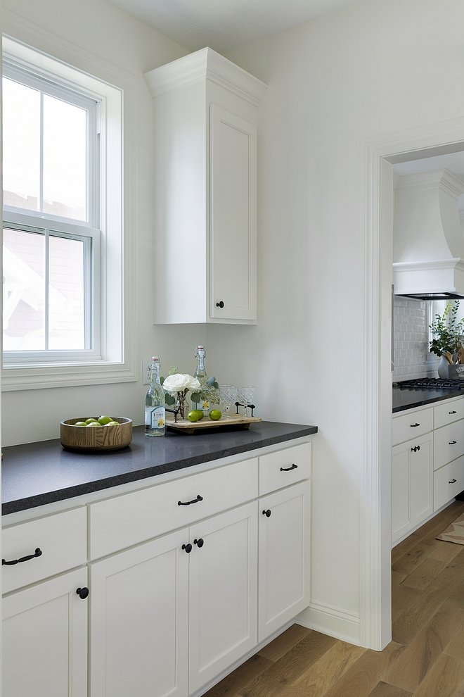 Benjamin Moore OC-17 White Dove Kitchen Cabinet with honed black granite and black hardware