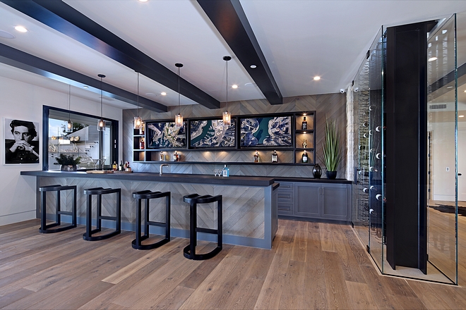 Frameless glass enclosure wine room ideas The two-story frameless glass enclosure wine room continues from the kitchen to the lower level #bar #basement #glassenclosure