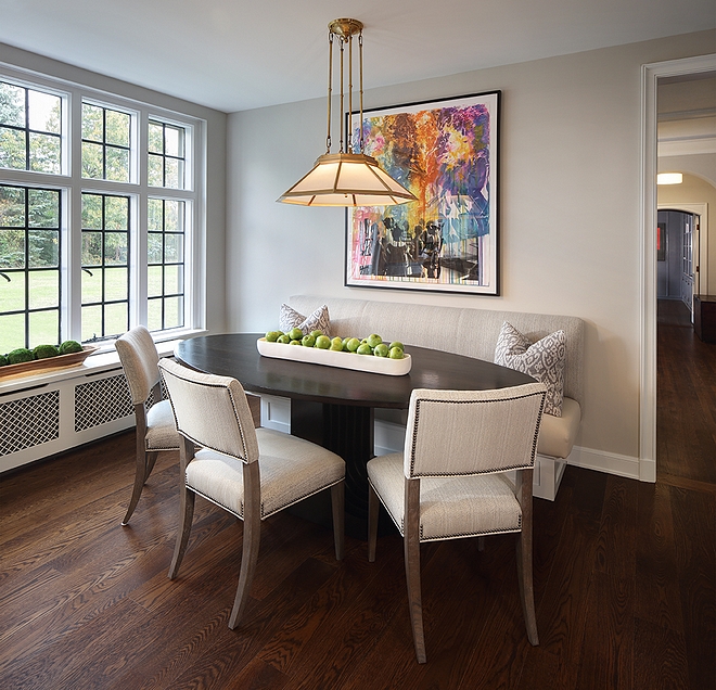 Breakfast Room This cozy breakfast room features a custom banquette and an oval dining table