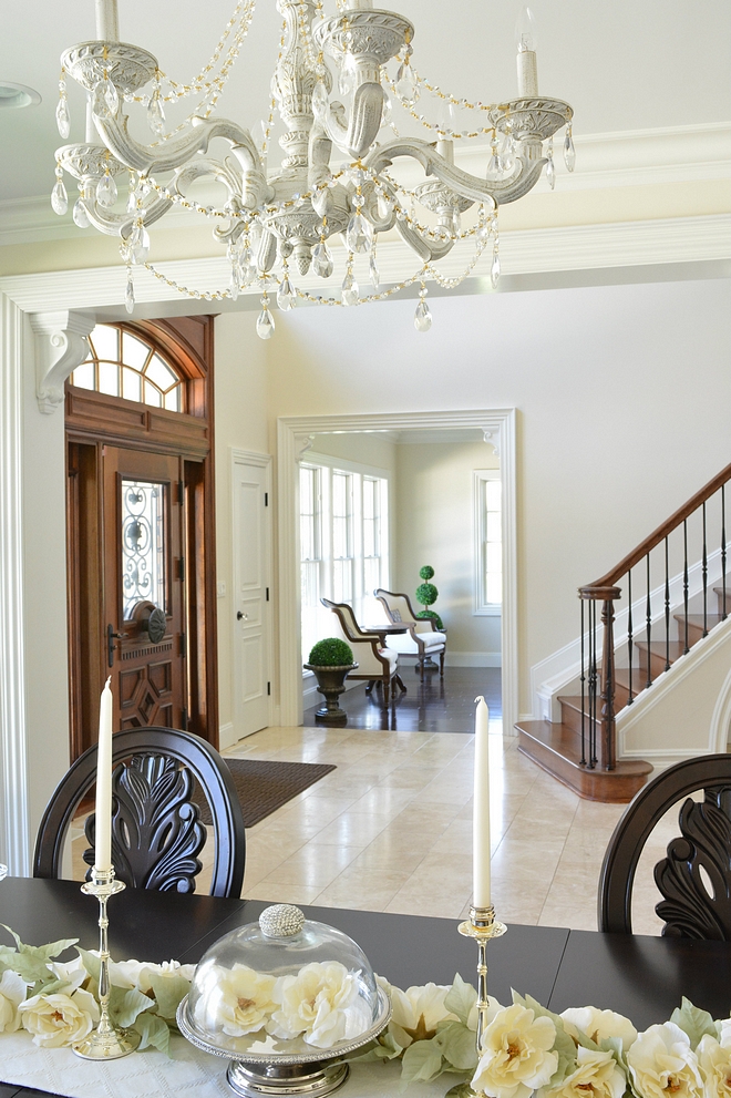Traditional Foyer opens to Dining Room with painted chandelier #traditionalhomes #traditionalinteriors