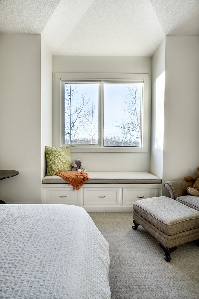 Simple kids bedroom window seat with storage drawers