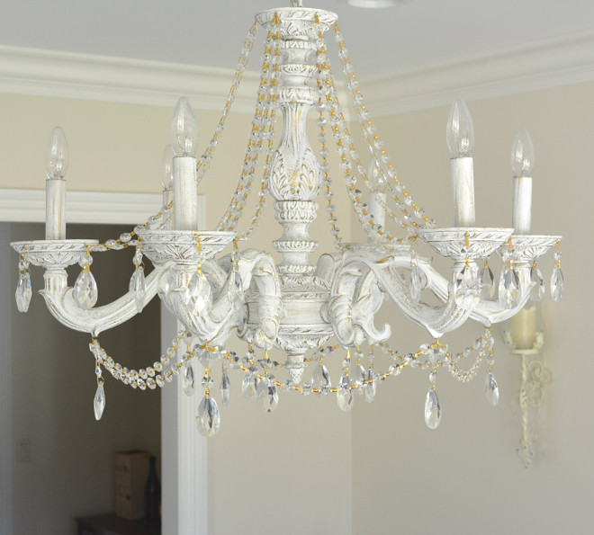 Traditional Chandelier Painted Here’s a close up of our chandelier from Wayfair I just love the distressed look and how the gold accents of the crystal chain pop against the white of the wood