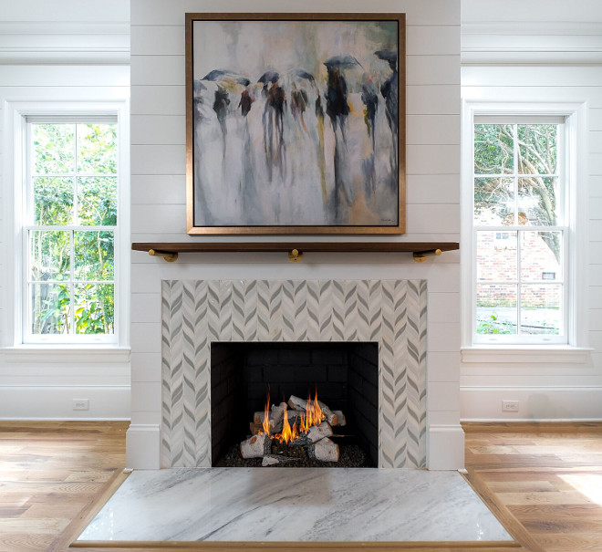 Carrera marble hearth Custom tile surround 42" Isokern vent free natural gas fireplace Shiplap accent wall Sleek Mantel Ideas
