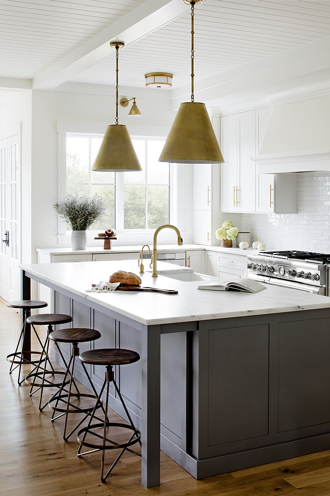 Dark grey island Dark grey kitchen island with honed white marble industrial backless counterstools brass cone pendant light and ceiling with tongue and groove paneling #kitchen #kitchenisland #darkgreykitchenisland #greyisland