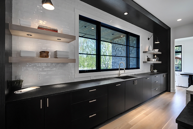 Kitchen Sink Cabinetry Kitchen Sink Cabinetry The kitchen sink wall features built-on-site 1⁄4 Sawn Oak kitchen cabinetry with extensive drawer detailing, pull out trash cans and cabinets to the ceiling #KitchenSinkCabinetry #SinkCabinetry