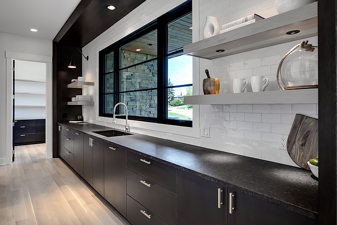 Kitchen sink wall Kitchen sink wall with lower cabinets floating shelves and large black windows Kitchen sink wall #Kitchen #sinkwall