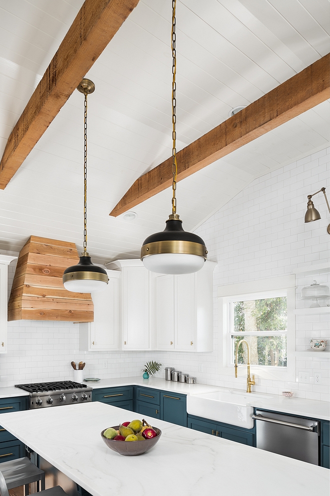 Farmhouse Kitchen with beams and shiplap Farmhouse Kitchen features painted shiplap and beams on a vaulted ceiling #farmhousekitchen #farmhousekitchenshiplap #beams #ceiling #farmhousekicthen #farmhousekitchenceiling #shiplap