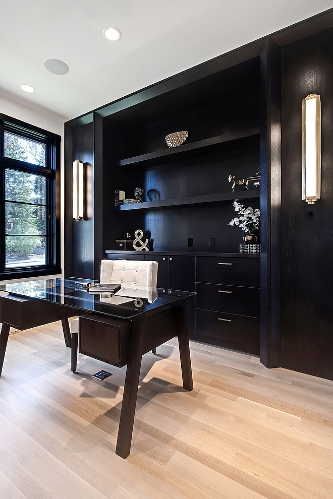 Home Office Black Cabinetry Home Office Ebony stained built in cabinets look great with black steel windows and light hardwood flooring #homeoffice #ebonycabinetry #blackwindows #lighthardwoodflooring