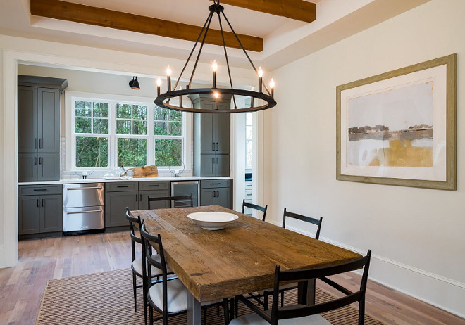 Farmhouse Dining Room with Grey Butler's Pantry Beautiful Farmhouse Dining Room with ceiling beams, hardwood flooring and Grey Butler's Pantry #FarmhouseDiningRoom #GreyButlersPantry