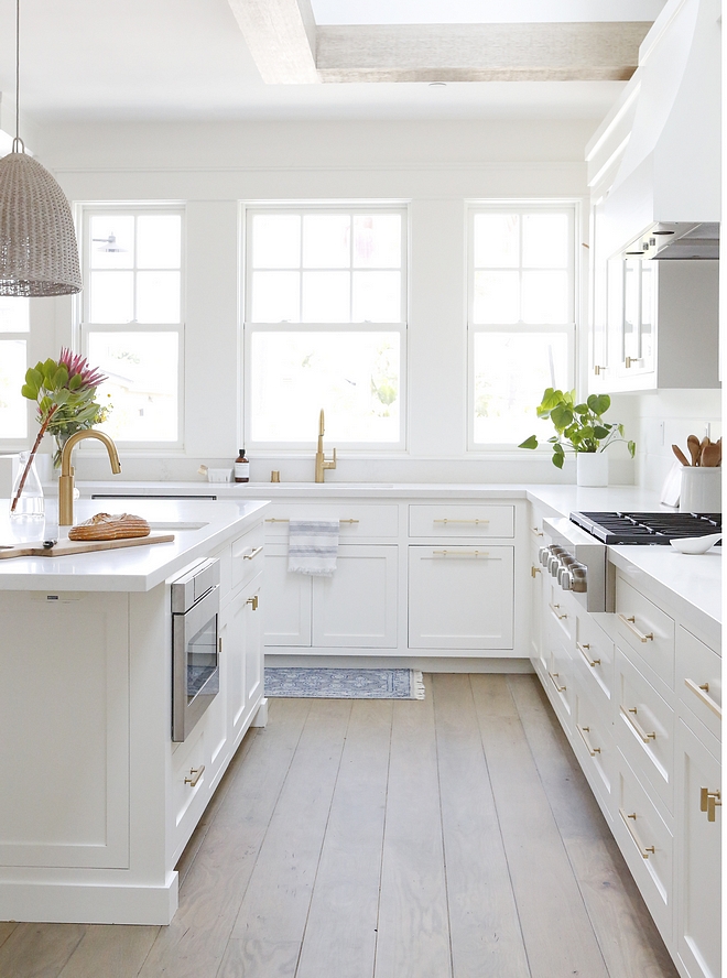 White Kitchen Cabinet The cabinetry was custom built as framed inset and painted Simply White by Benjamin Moore #whitekitchen #whitekitchencabinet #kitchencabinet #kitchencabinetry