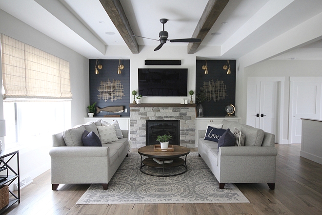 Farmhouse Living Room In the Living Room, there are many details that I adore, but one of my most favorite is the navy shiplap on either side of the fireplace. It was definitely a bold decision, but one that we absolutely LOVE! Farmhouse Living Room #Farmhouse #FarmhouseLivingRoom #LivingRoom