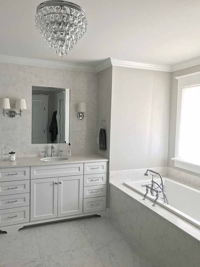 White Marble Bathroom Tile The floor tiles are Eon Carrara 24 inch rectified floor tiles from Atlas Concorde with Rolling Fog grout White Marble Bathroom Tile #WhiteMarble #Bathroom #Tile