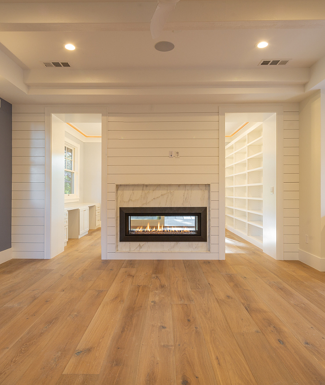 Shiplap Fireplace Two sided shiplap fireplace in master bedroom separating the main area to the bedroom sitting area Fireplace stone is Calacatta Cremo marble Shiplap Fireplace Shiplap Fireplace #ShiplapFireplace