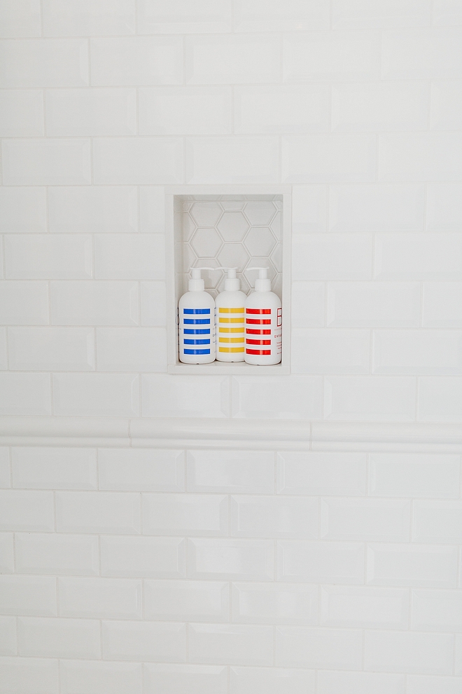 Shower 3x6 beveled white subway tile The walls have beveled high gloss 3 x 6 arctic white subway tile with white grout, capped in a chair rail beveled white subway tile #beveledwhitesubwaytile