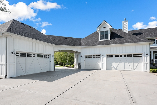 Board and Batten Garage with porte cochere This home features a 3 car attached garage and an additional heated garage/workshop with car lifts Board and Batten Garage Board and Batten Garage Board and Batten Garage #BoardandBattenGarage #BoardandBatten #Garage