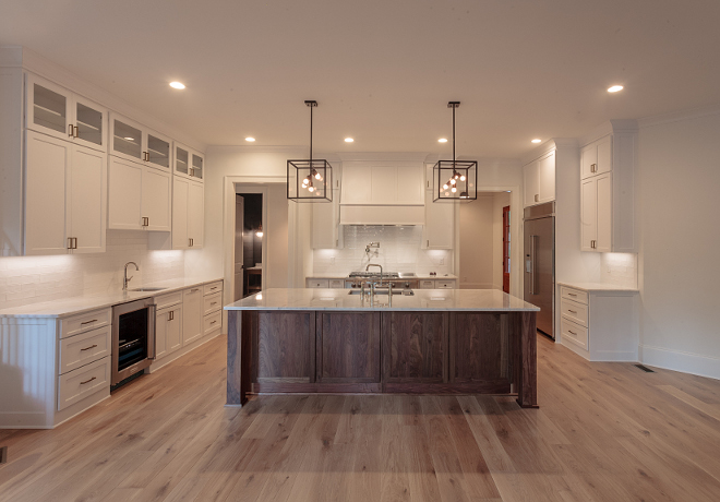 BM Super White kitchen cabinets with Walnut island and light White Oak hardwood flooring #bmsuperwhite