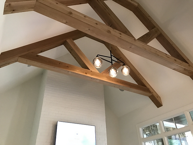 Exposed trusses ceiling with modern chandelier exposed trusses ceiling #exposedtrusses #trussesceiling