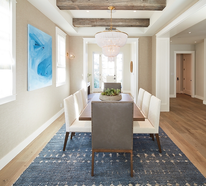 Neutral Farmhouse Dining Room with Ceiling Beam Dining room feels neutral, casual but tailored at the same time Walls feature a Holland and Sherry wallpaper #diningroom #neutraldiningroom #farmhosuediningroom