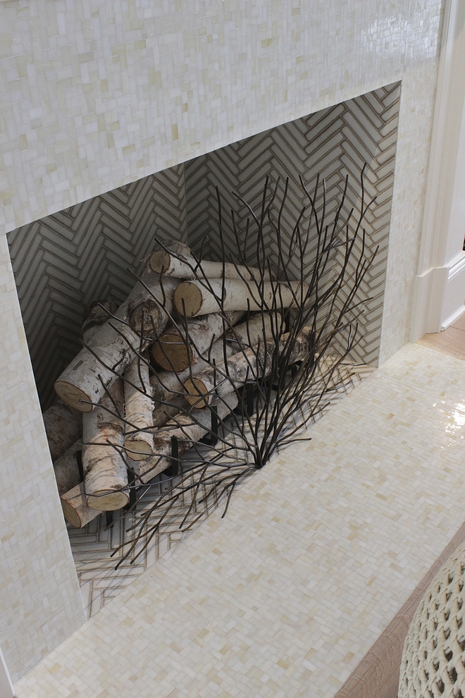 Fireplace Tile The fireplace features mini-mosaic tile and white herringbone tile #fireplacetile