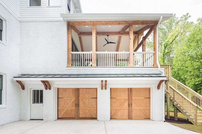 We balanced the all white exterior with beautiful cedar accents. In the back of the home we let the natural cedar steal the show on the beams and garage doors by using a clear coat only