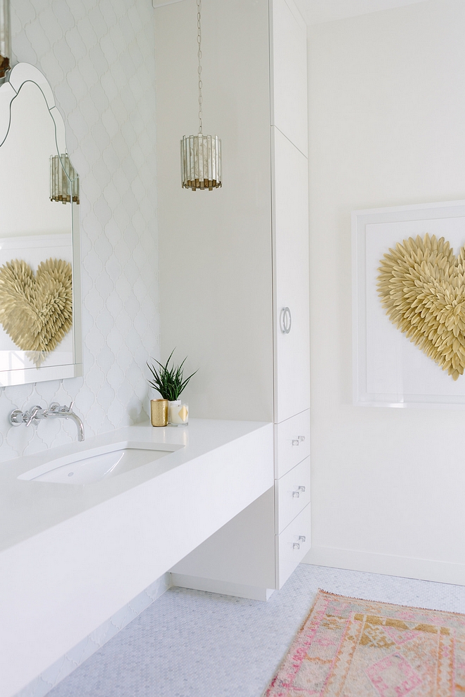 Bathroom Delicate and timeless choices bring a timeless yet current feel to this bathroom. Vanity is wrapped in a white quartz #Bathroom #whitequartz