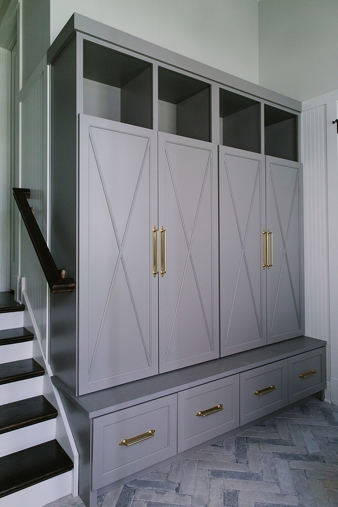 Mudroom cabinet is custom-designed and crafted cabinetry with X detail. Cabinet paint color is Benjamin Moore Graystone with Caesarstone ledge in Sleek Concrete #Mudroomcabinet #customcabinet #cabinetry #Xdetailcabinet #BenjaminMooreGraystone