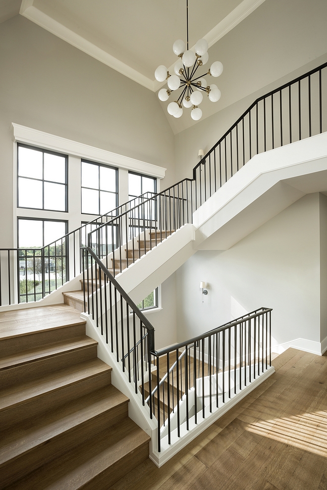 Benjamin Moore Collingwood Staircase with White Oak threads and risers with metal railing and walls painted in Benjamin Moore Collingwood #BenjaminMooreCollingwood