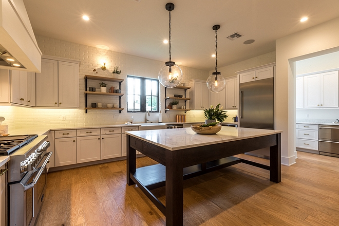 White Kitchen New White Kitchen design This white kitchen features shaker-style cabinets, a large Oak island and a great layout. Notice the butler's pantry on the right #whitekitchen #newwhitekitchen #newwhitekitchendesign
