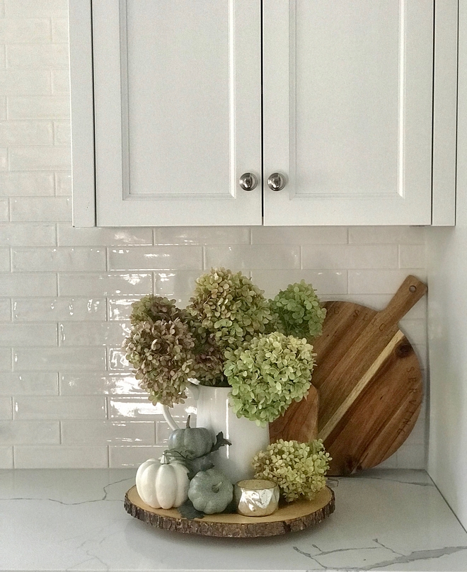 I welcome fall into our home by clipping large bunches of Limelight hydrangeas from the garden and filling up various vases. You’ll find a vase filled with hydrangeas in almost every room of our home #kitchen #Fall #kitchenfall #hydrangeas