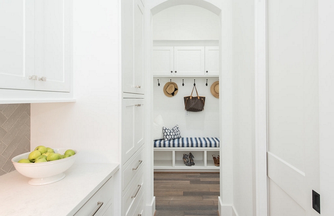 A mudroom is located just off the kitchen area. Notice the pantry door on the right #mudroom #pantry #pantrydoor