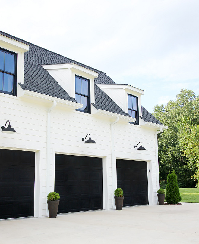Farmhouse Garage White modern farmhouse with black garage doors The garage doors are standard metal doors, and we used a gel stain by Minwax The color is Antique Black #farmhosuegaragedoor #garagedoor #blackgaragedoor #modernfarmhouse