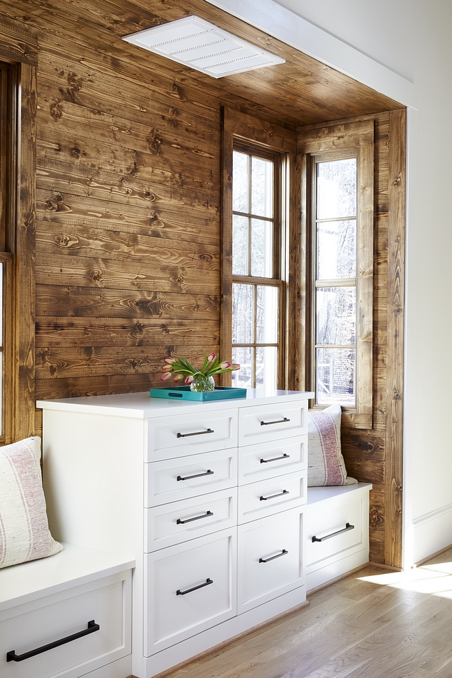 Bedroom Built-in Dresser tucked into a nook with stained shiplap walls Built in dresser features built in seats on both sides #bedroom #builtindresser #dresser #customdresser #builtindressers #windowseats #shiplap