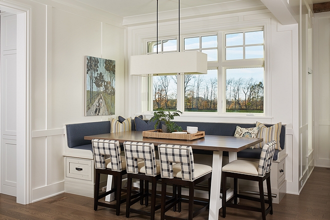 Breakfast room The breakfast room features a counter-height table and counterstools with a custom elevated banquette #breakfastroom #banquette