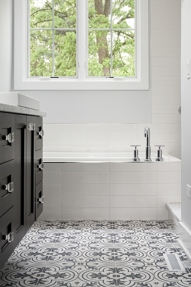 Affordable bathroom tile combination ideas The tub is surrounded by 4x16 white subway tile