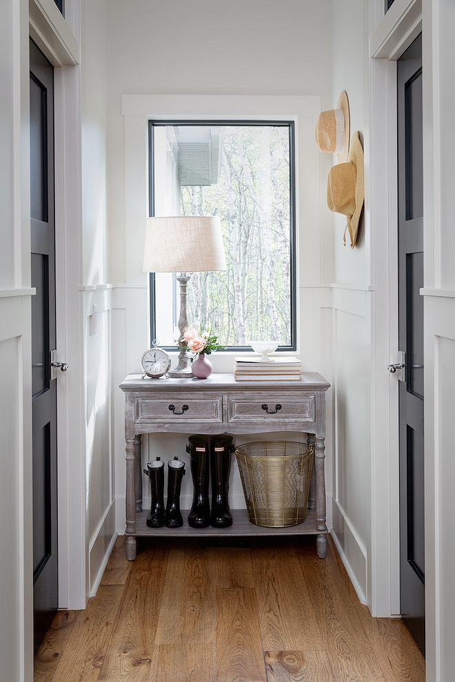 This hallway lets tons of light in, and connects the home from garage to great room. I found the perfect small console to fit this space for ditching keys and sunglasses when you get home #hallway #console #consoletable