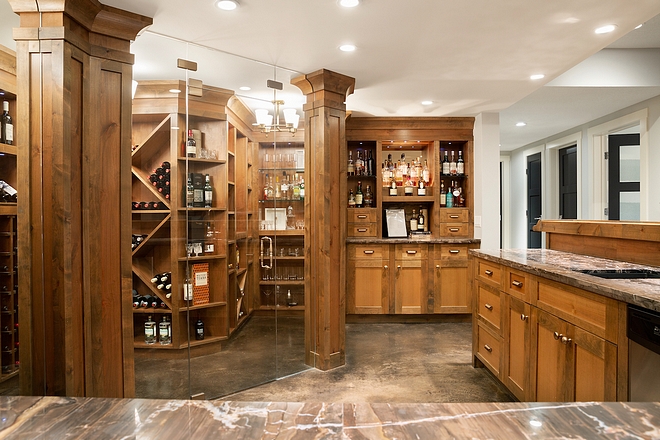 Wine Room Alder Cabinetry Wine Room This amazing 650+ bottle wine room and bar is definitely a focal point in the basement #WineRoom #Basement