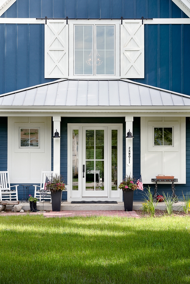 Front Door Front Porch A glass front door with sidelights is flanked by two windows with custom board and batten trim Front Door Front Porch #Boardandbatten #trim #exteriortrim #FrontDoor #FrontPorch