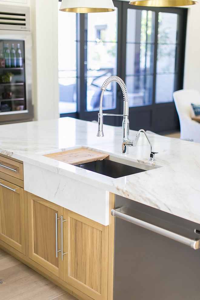 Kitchen Countertop is Calacutta Umber marble - Honed Kitchen Sink is stainless steel but the designer added a marble slab to add the "apron sink" look without having to compromise on having a more durable stainless steel sink #kitchen #kitchencountertop #kitchensink